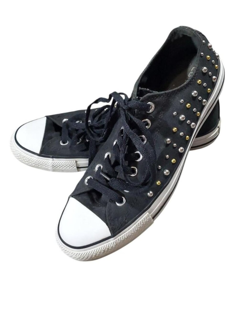 Black Converse sneakers with silver and gold studs